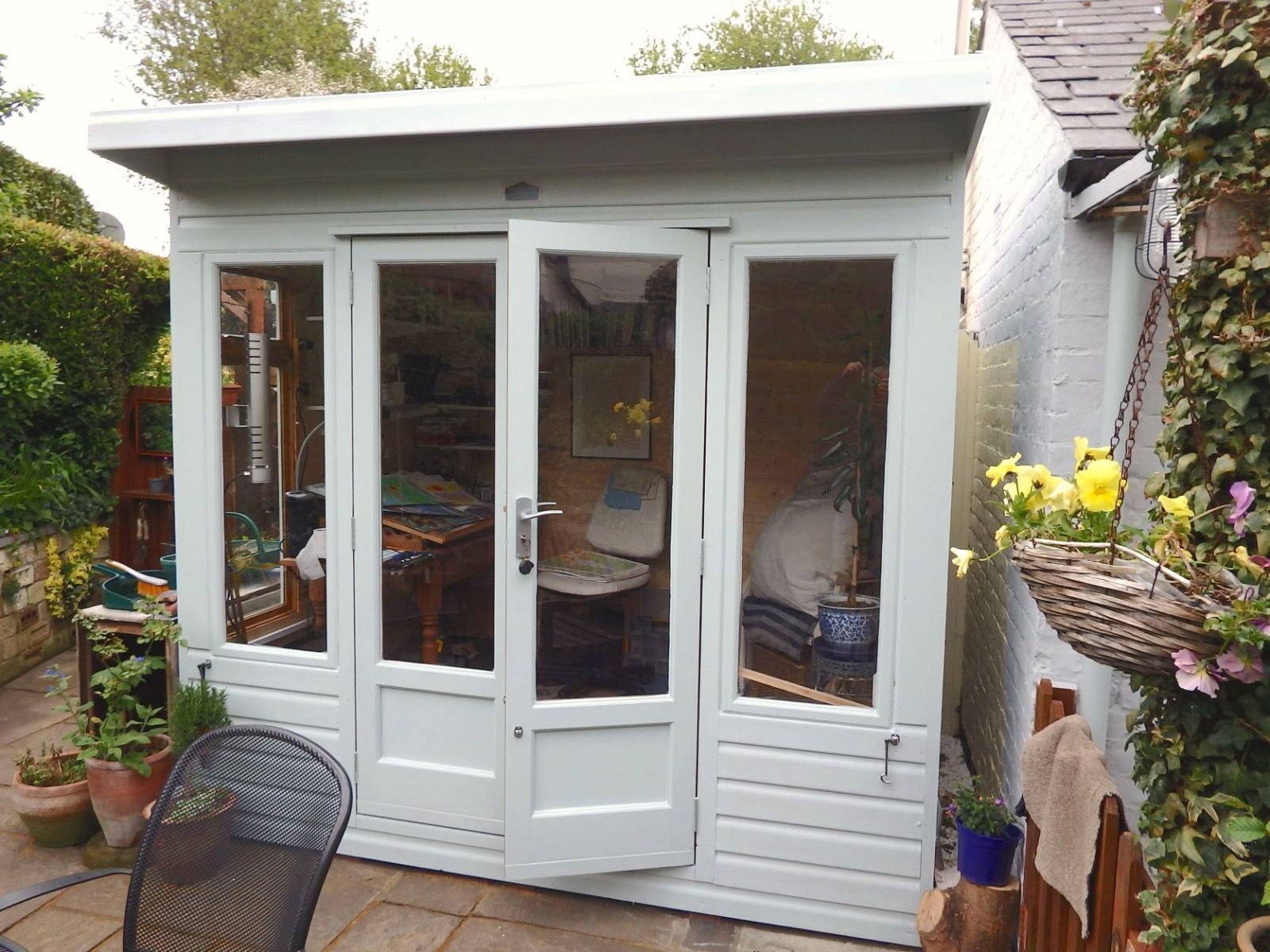 A garden building set up as a creative studio space