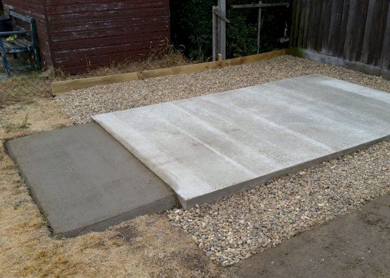 Concrete base with gravel surround and ramp