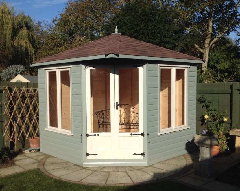 Cambridgeshire Corner 100 Summerhouse 10ft x 10ft (3.0m x 3.0m). Painted finish, black door furniture & brown felt tiles