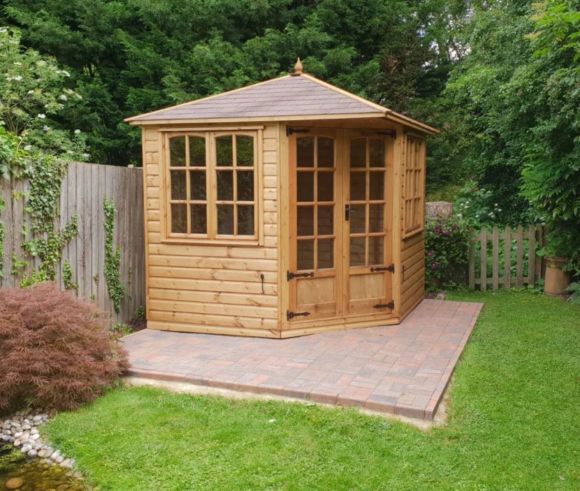 Cambridgeshire Corner 88 Summerhouse 7ft 8in x 7ft 8in (2.3m x 2.3m). Sadolin finish & brown felt tile roof