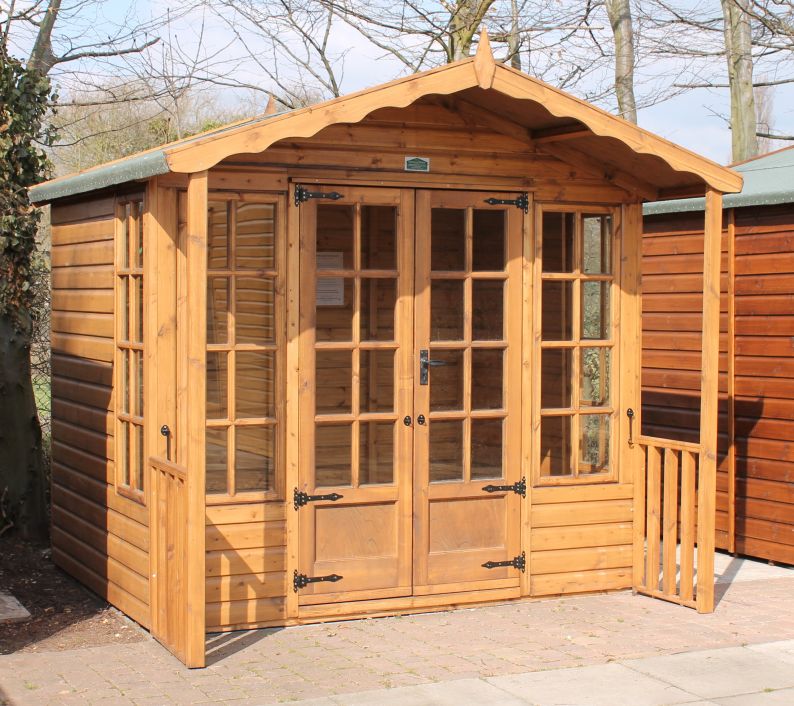 8ft x 6ft (2.4m x 1.8m) with 2ft (0.6m) veranda in Sadolin finish